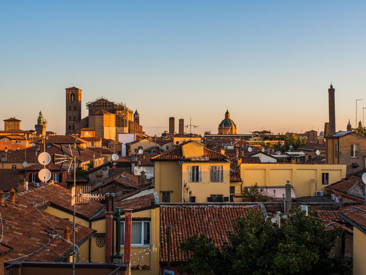 Sunrise view over Bologna rooftops and skyline.