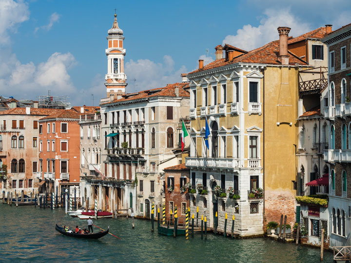 Grand Canal and colorful buildings of Venice, among the must see cities in Europe for first timers.