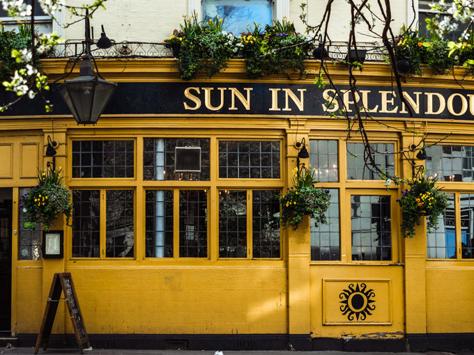 Yellow facade of Sun in Splendour pub in Notting Hill London.