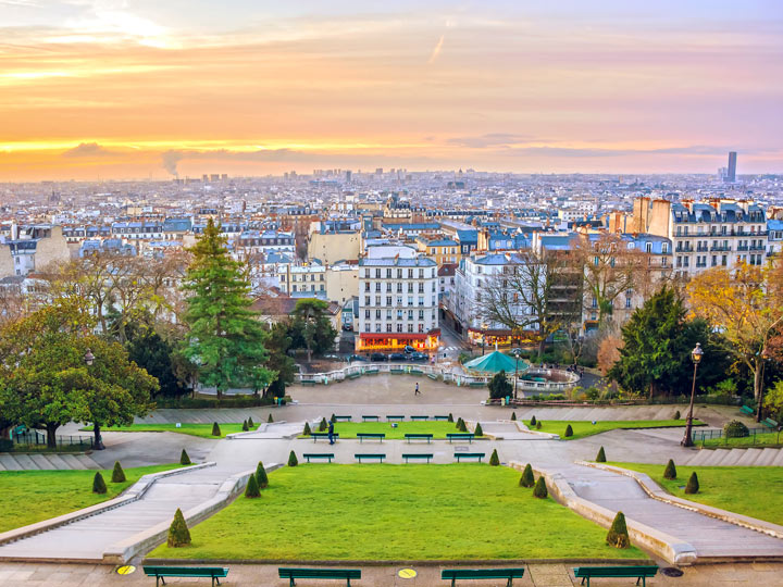 Sunrise in Montmartre Sacre Coeur park, a great place to stay for a 4 day Paris itinerary.