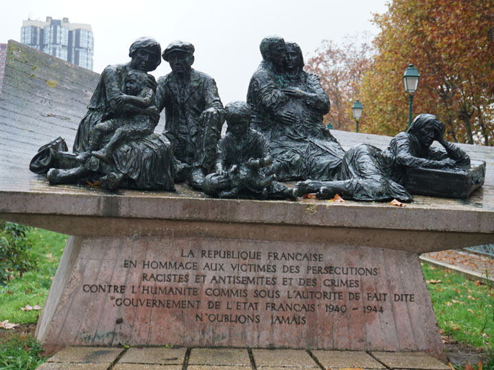 Paris Vel d'Hiv monument with autumn tree in background.