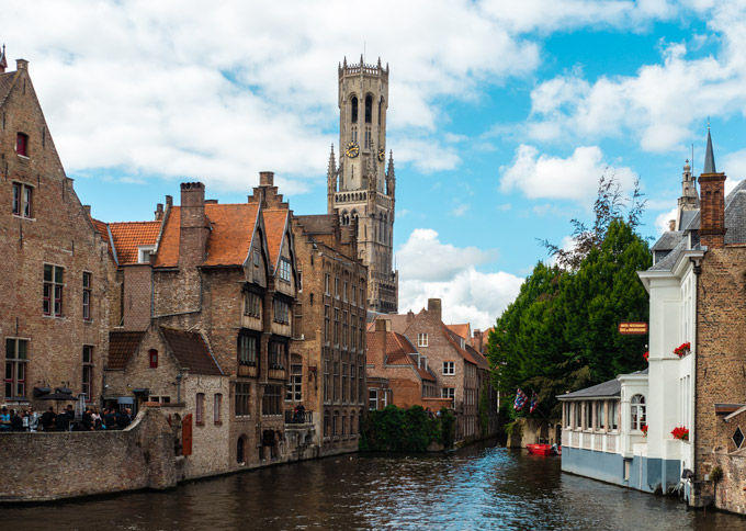 Bruges canal view of old market and belfry.