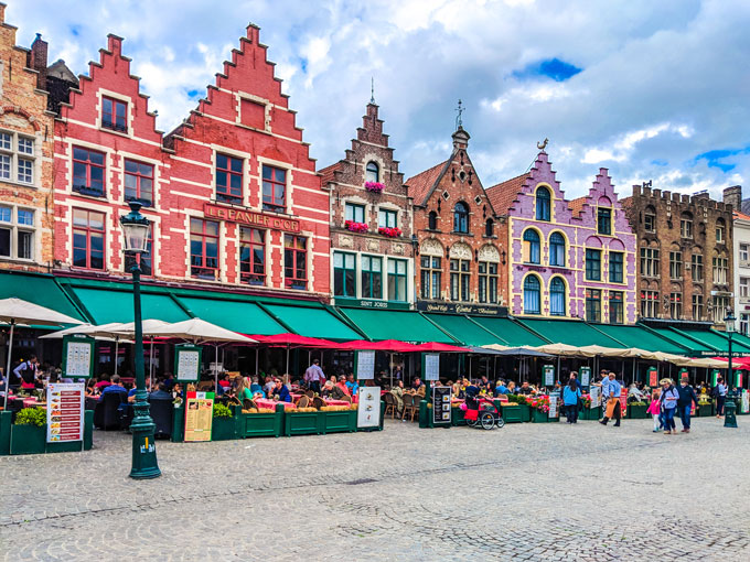 Colorful buildings in Bruges town square market