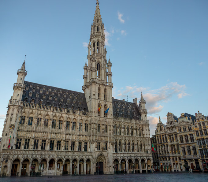 Exterior of Brussels Grand Place town hall and empty square.