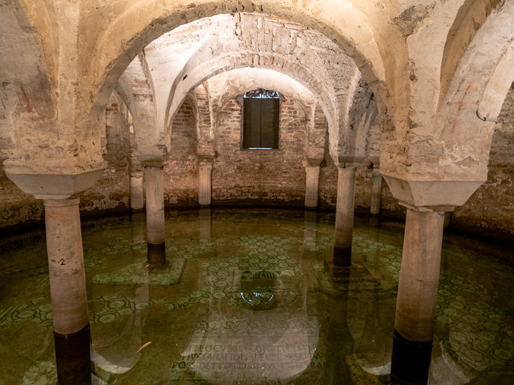 Water filled crypt with mosaic floor in Basilica di San Francesco Ravenna.