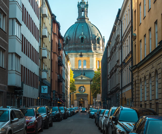 View of yellow church down street as seen during one day in Stockholm itinerary.