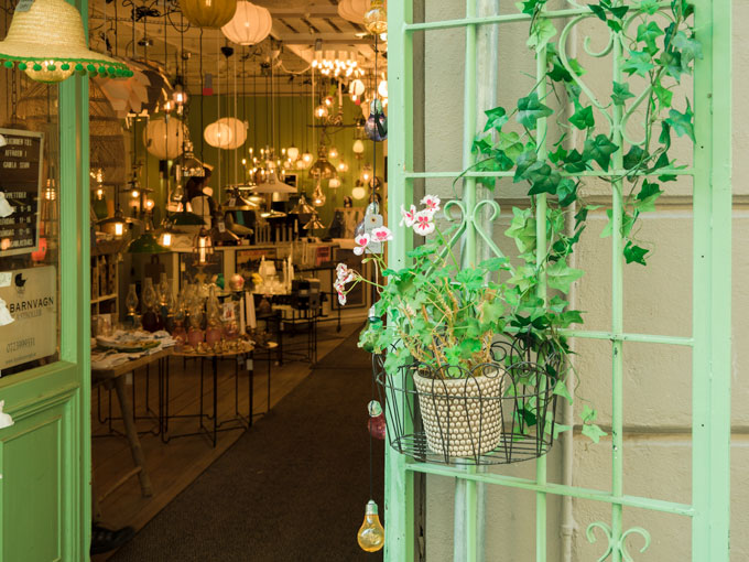 Shopping Light Store in Gamla Stan Stockholm with green painted facade.