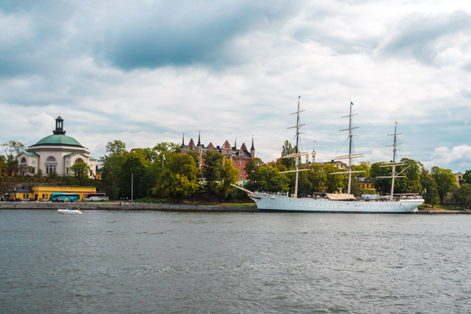 One Day in Stockholm Skeppsbrokajen river with old sailing boat.