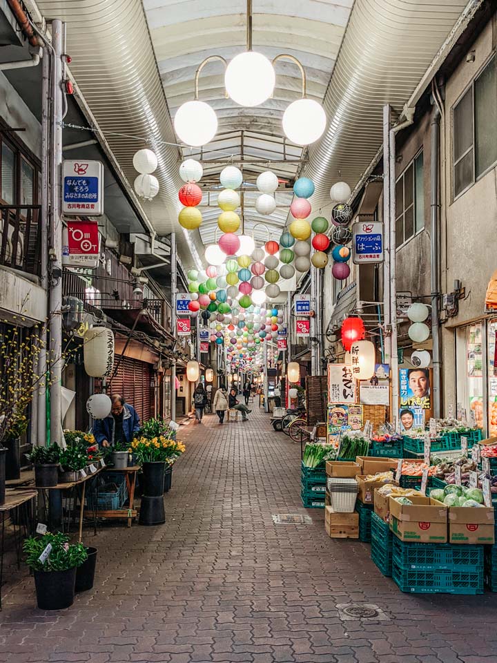 Kyoto covered shopping street with paper lanterns hanging
