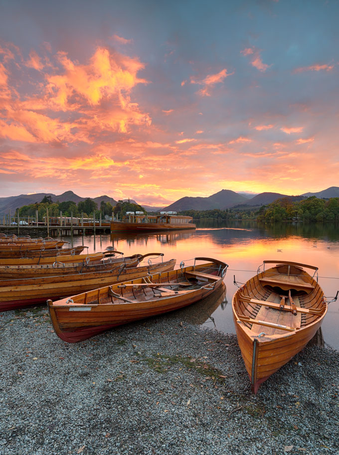 Six wooden boats about to embark on romantic Lake District breaks for couples.