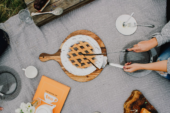 Having an outdoor picnic, a romantic staycation idea.