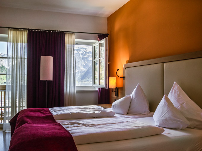 Interior of Heritage Hotel Hallstatt bedroom with window view.