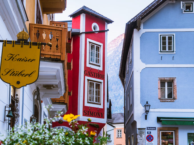 Hallstatt village center with flowers and colorful buildings, one of the most popular Hallstatt tourist attractions.