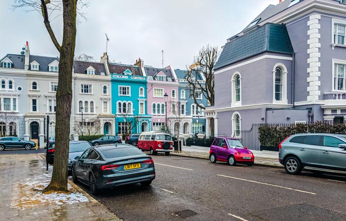 Street view of colorful London houses.