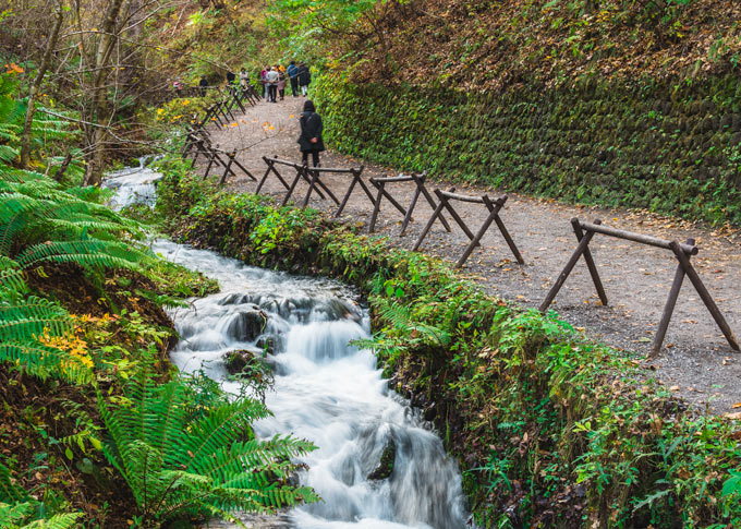 Karuizawa Shiraito Waterfall stream along walking path.