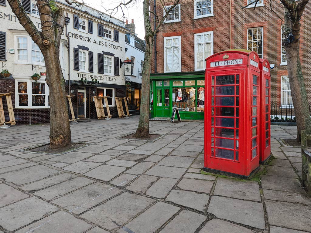 Historic buildings and red phonebox in London Richmond area.
