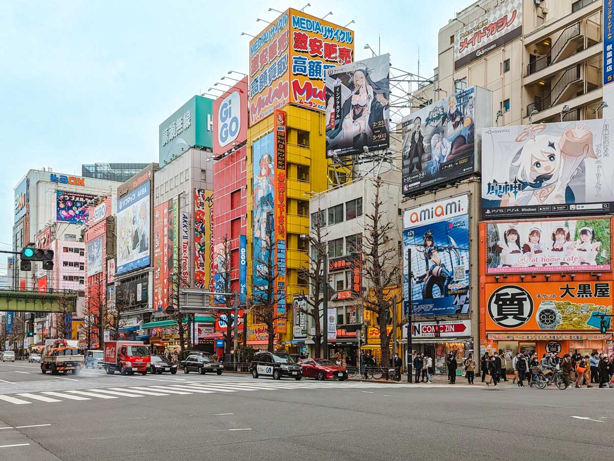 Street view of Akihabara billboards and colorful buildings.