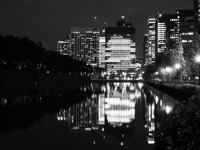 View of Tokyo skyline at night from Hibiya Park.