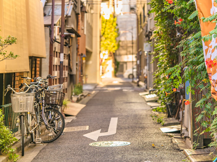 Typical Japan street with bikes seen when traveling Tokyo like a local.