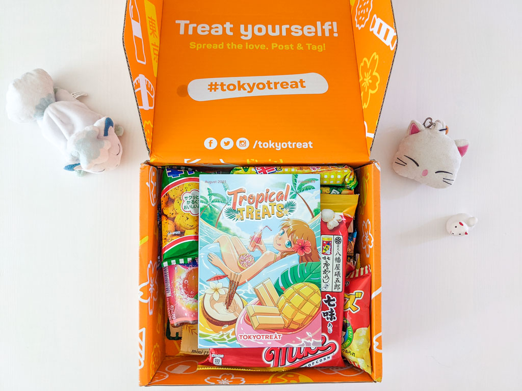 Open TokyoTreat box with tropical theme guidebook on top.