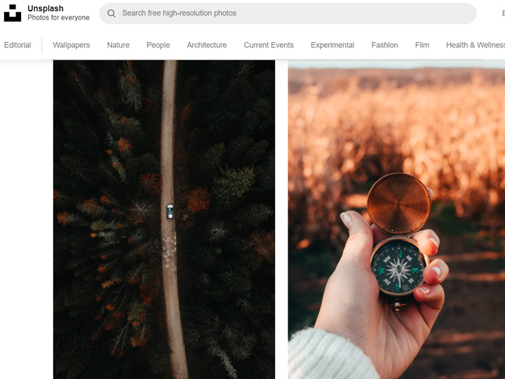 Screenshot of Unsplash website, with photos of car driving through forest and hand holding old metal compass.