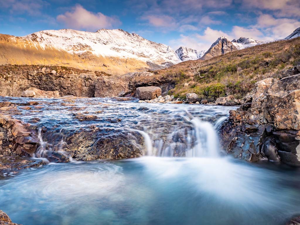 Water flowing into Isle of Skye's Fairy Pools, one of the top UK bucket list attractions.