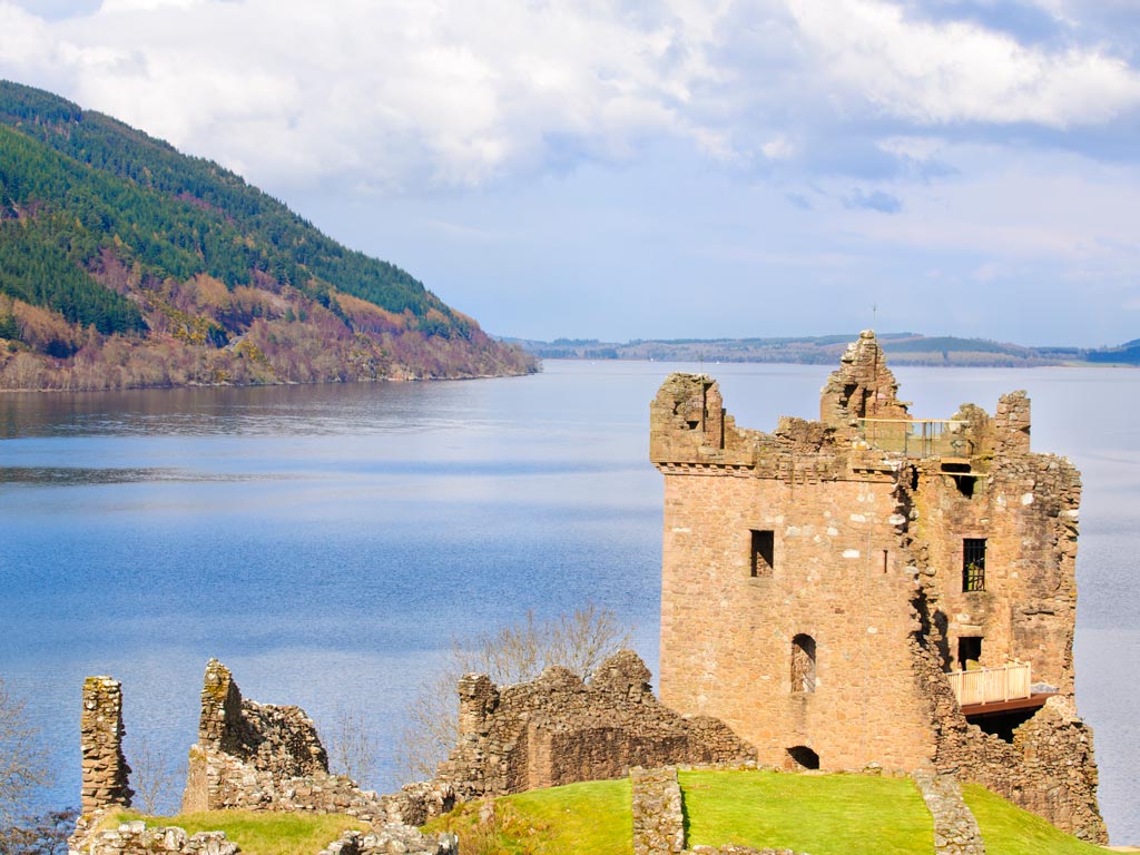 Partially ruined castle in front of Loch Ness.