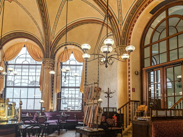 Elegant golden interior of Cafe Central Vienna, a must for any Vienna itinerary.