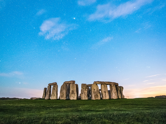 See Stonehenge for free at twilight with blue night sky.