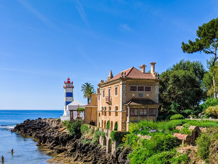 Cascais Lighthouse Museum of Santa Marta with beach and ocean view and green park.